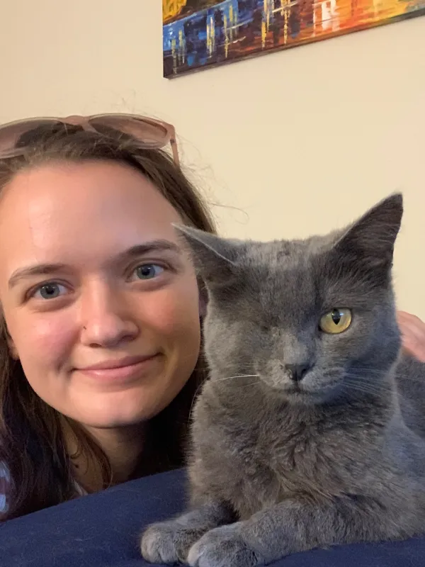 Leah with her cat (short with gray hair and missing one eye)